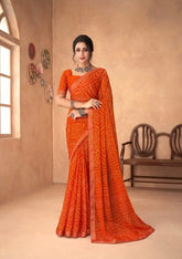 India Silk Orange Chiffon Saree Features A Beautifully Attached Banarasi Border Combining The Softness And Flow Of Chiffon