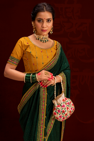 GREEN COLOUR HEAVY VICHITRA BLOOMING WITH SWAROVSKI WORK &SEQUENCE UNIQUE BORDER