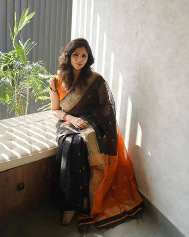 India Silk Black And Orange Sarees Made With Soft Lilian Slab Fabric Combine Traditional Charm With Exceptional Comfort