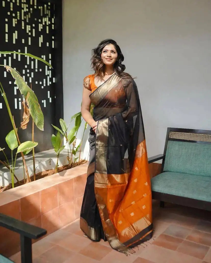 India Silk Black And Orange Sarees Made With Soft Lilian Slab Fabric Combine Traditional Charm With Exceptional Comfort