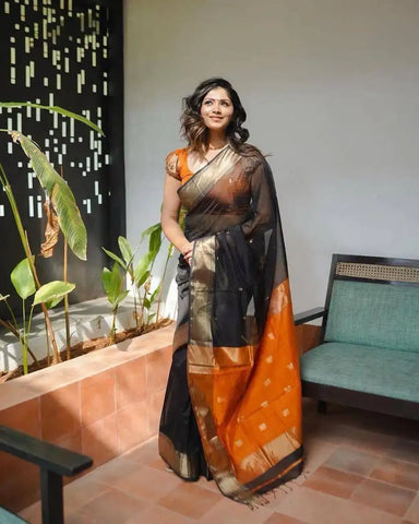 India Silk Black And Orange Sarees Made With Soft Lilian Slab Fabric Combine Traditional Charm With Exceptional Comfort