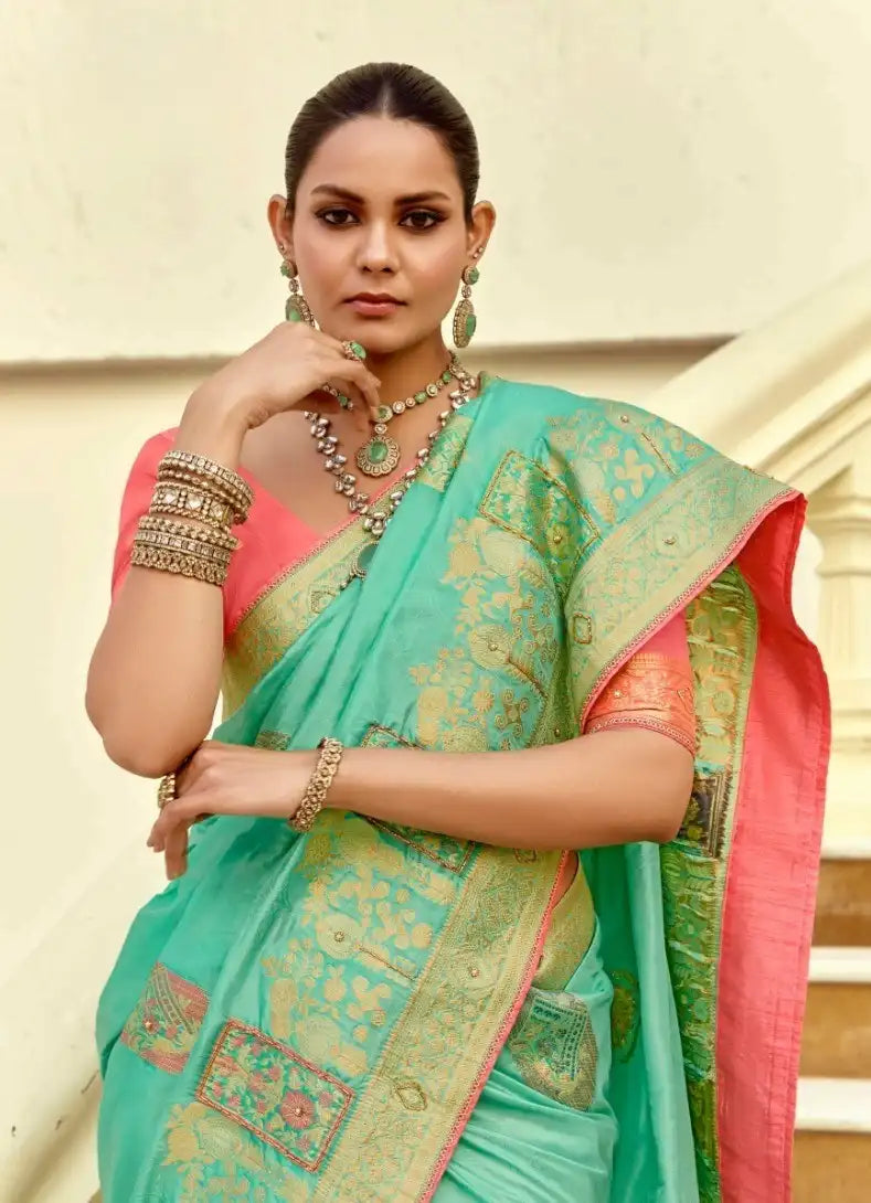 India Silk Sea Green Presents A Pure Viscose Saree Featuring A Delicately Hand-Worked Body That Showcases Exquisite Craftsmanship