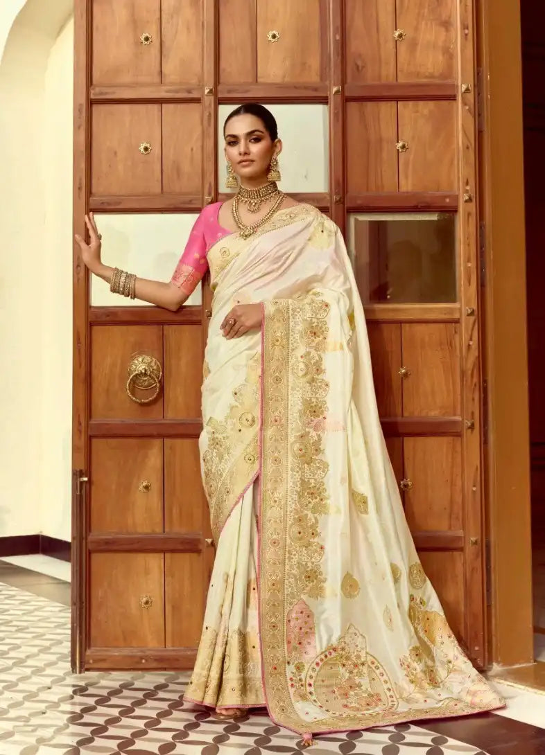 India Silk White Presents A Pure Viscose Saree Featuring A Delicately Hand-Worked Body That Showcases Exquisite Craftsmanship