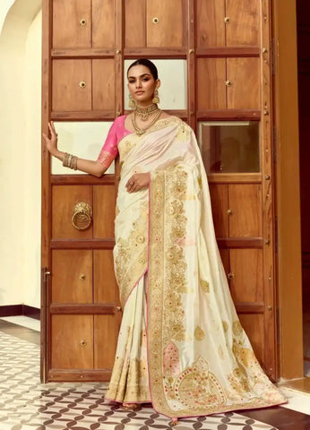 India Silk White Presents A Pure Viscose Saree Featuring A Delicately Hand-Worked Body That Showcases Exquisite Craftsmanship
