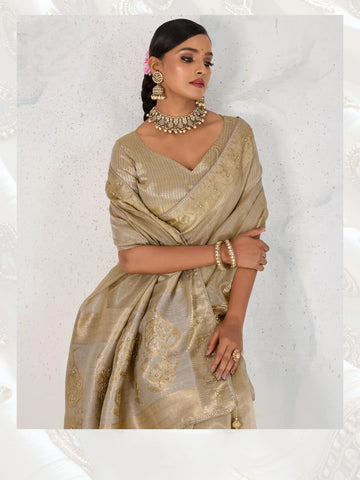 India Silk Grey Sarees Feature Premium Tissue Linen Fabric Enhanced With A Woven