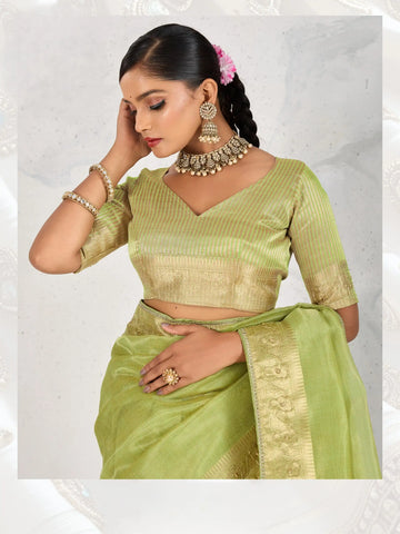 India Silk Mint Green Sarees Feature Premium Tissue Linen Fabric Enhanced With A Woven