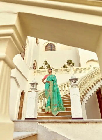 India Silk Sea Green Presents A Pure Viscose Saree Featuring A Delicately Hand-Worked Body That Showcases Exquisite Craftsmanship